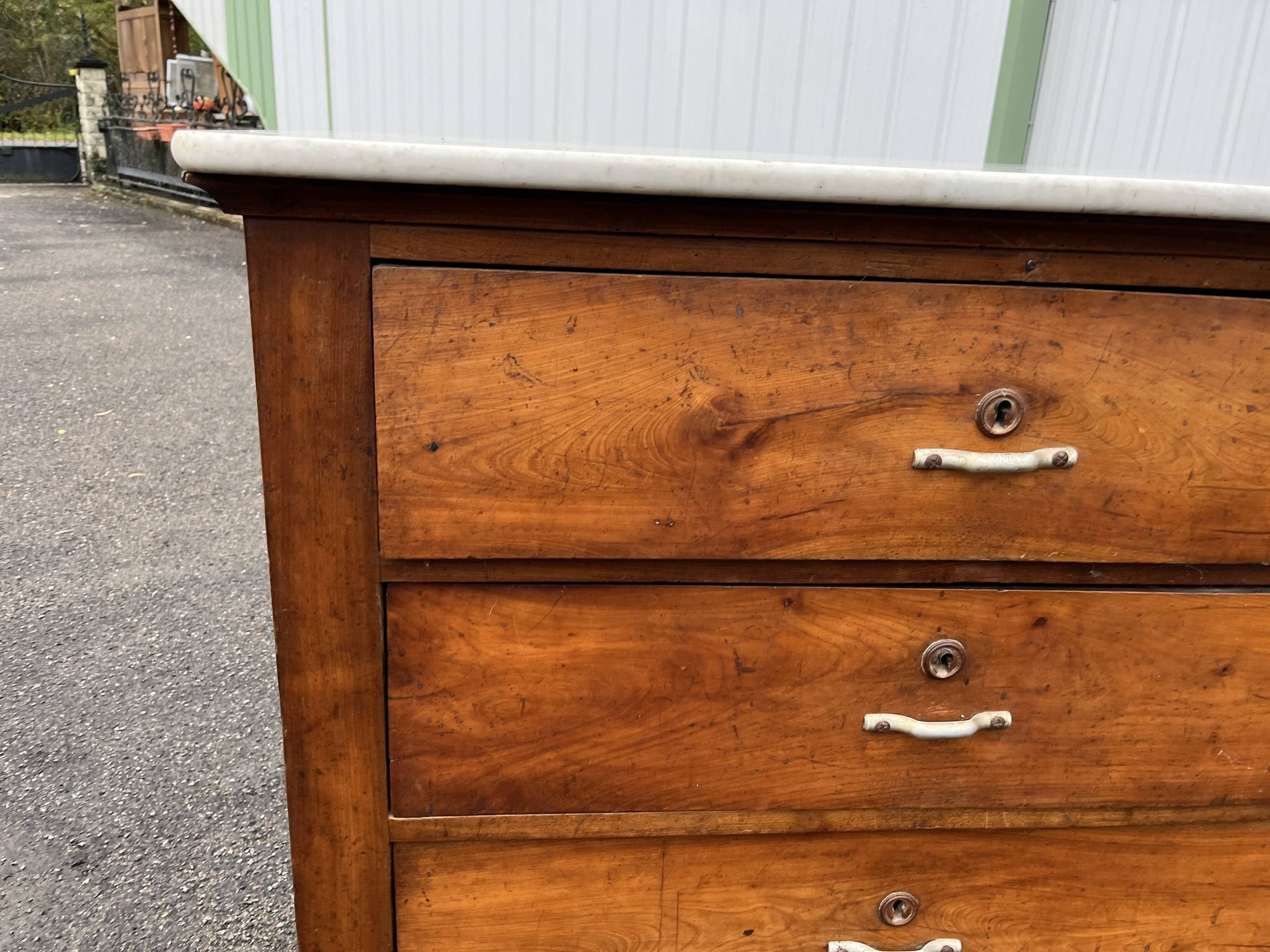 Antique 19th-century wooden chest of drawers with a marble top