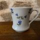 Set of 2 Istanbul and LImoges porcelain cups decorated with small blue flowers