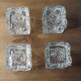 4 bougeoirs en verre ciselé