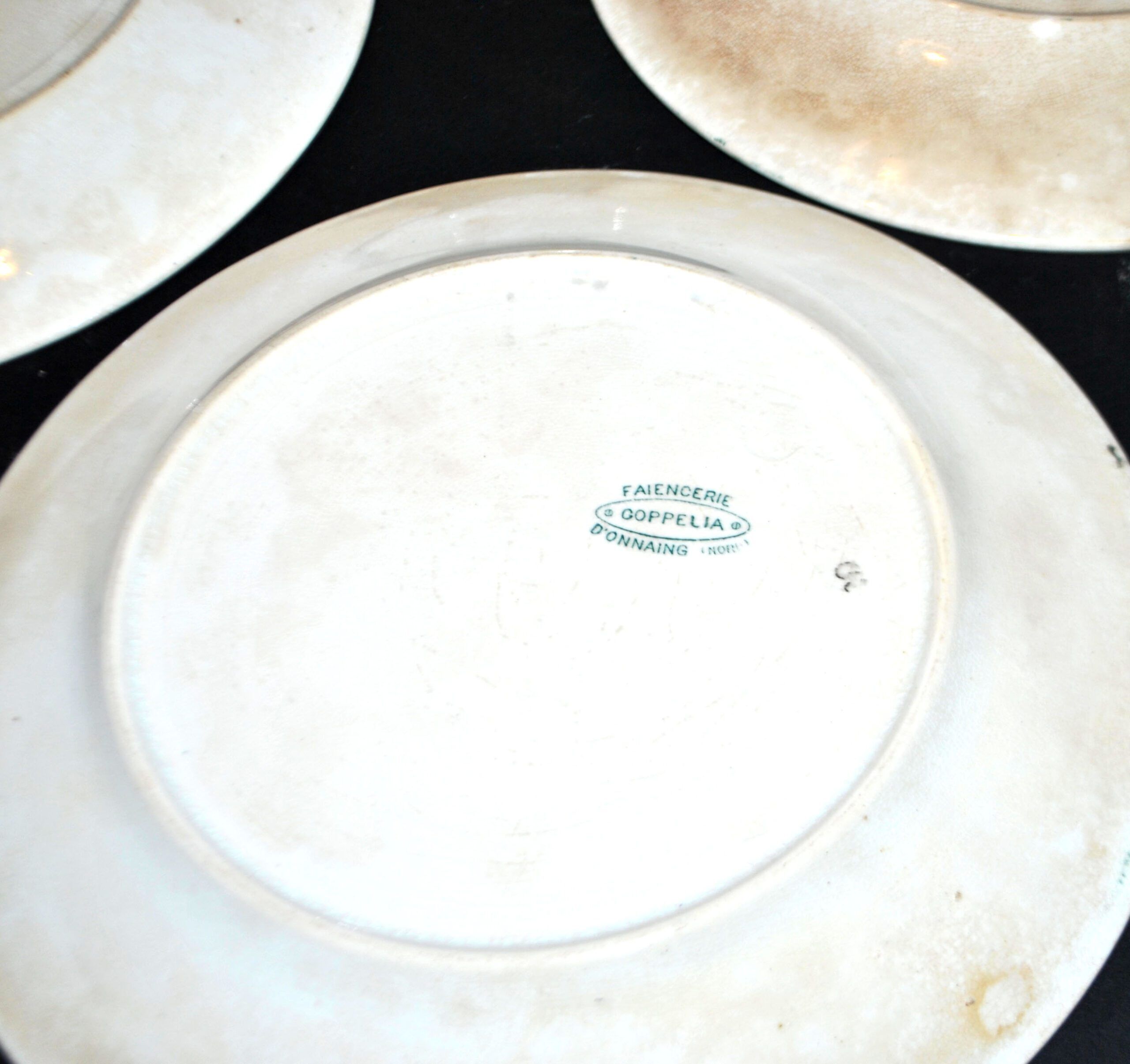 Onnaing Faïencerie set of 4 Coppelia plates with green floral decoration, iron earthenware