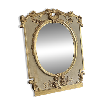 Miroir Napoléon III en bois doré sculpté, glace ovale au mercure