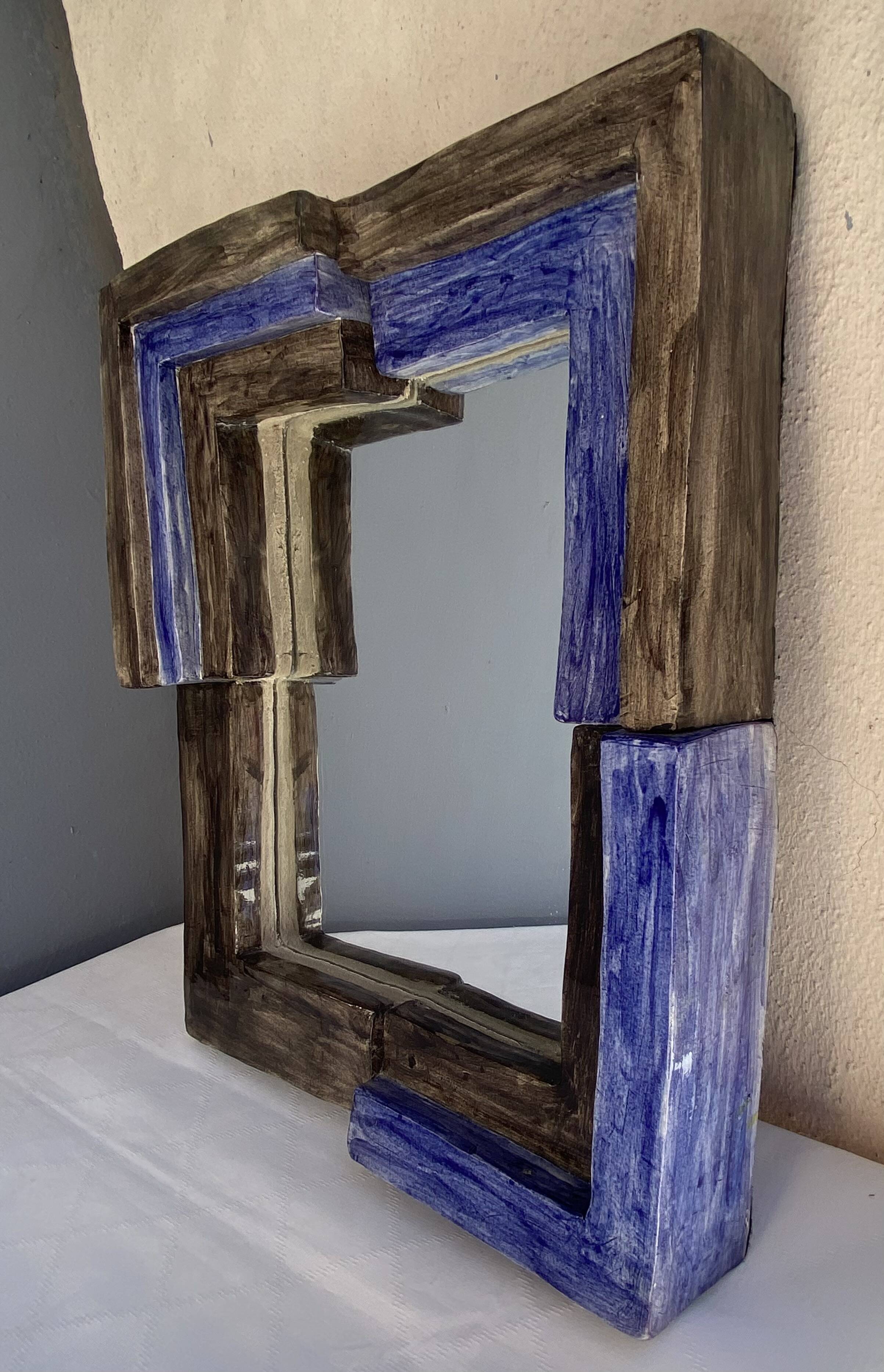 Mirror with ceramic frame