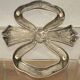 Lancel trivet, bow and ribbon, silver-plated metal