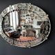 Antique oval Venetian mirror in engraved glass, Murano early 20th century.