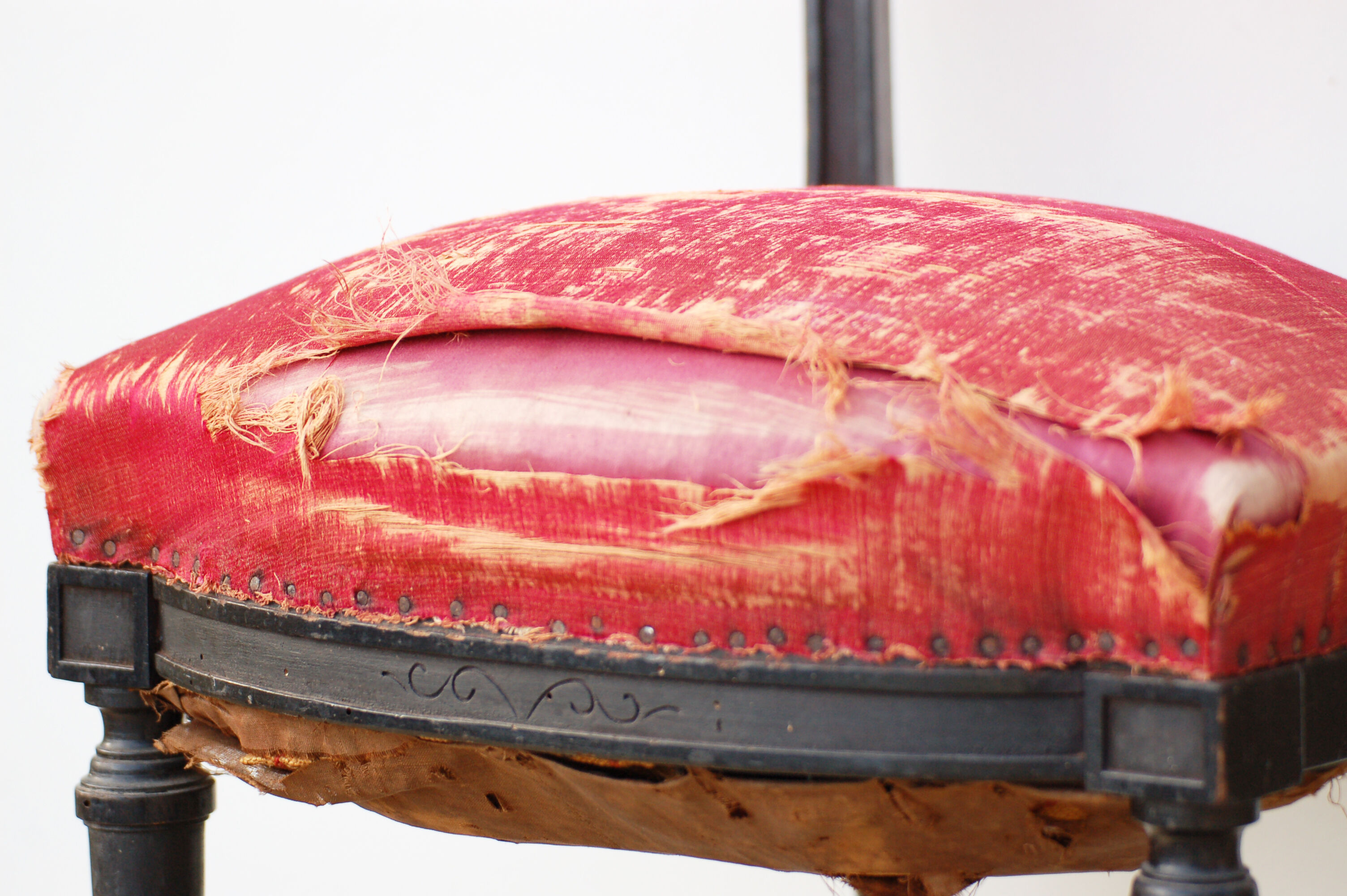 Pair of old black wooden chairs and Red seat.