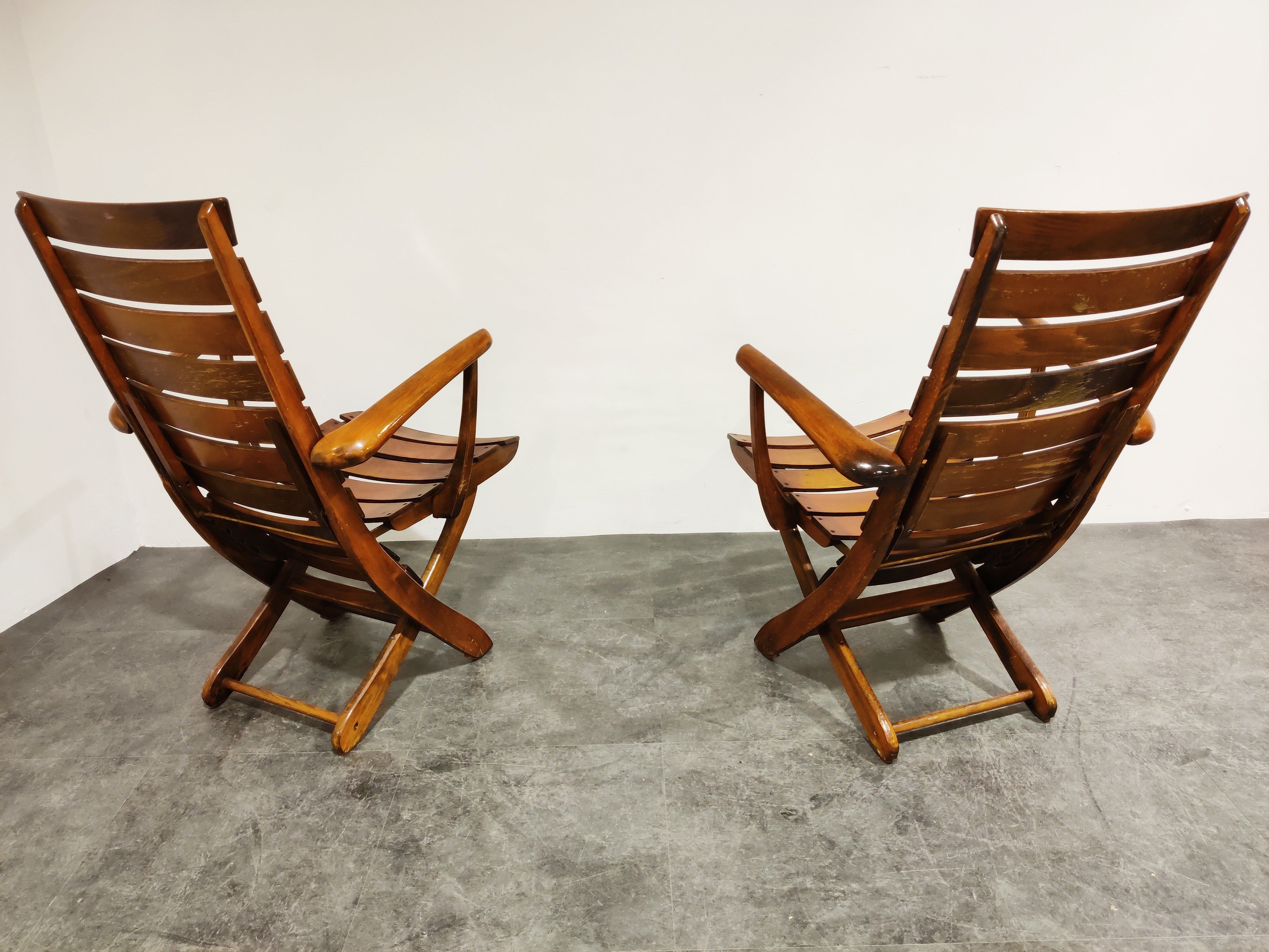 Pair of wooden folding garden chairs with table, 1950s