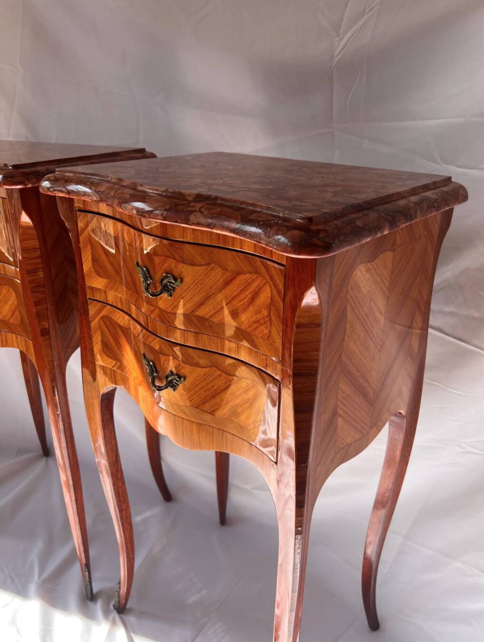 Pair of French rosewood bedside tables, marble top, inlaid beds.