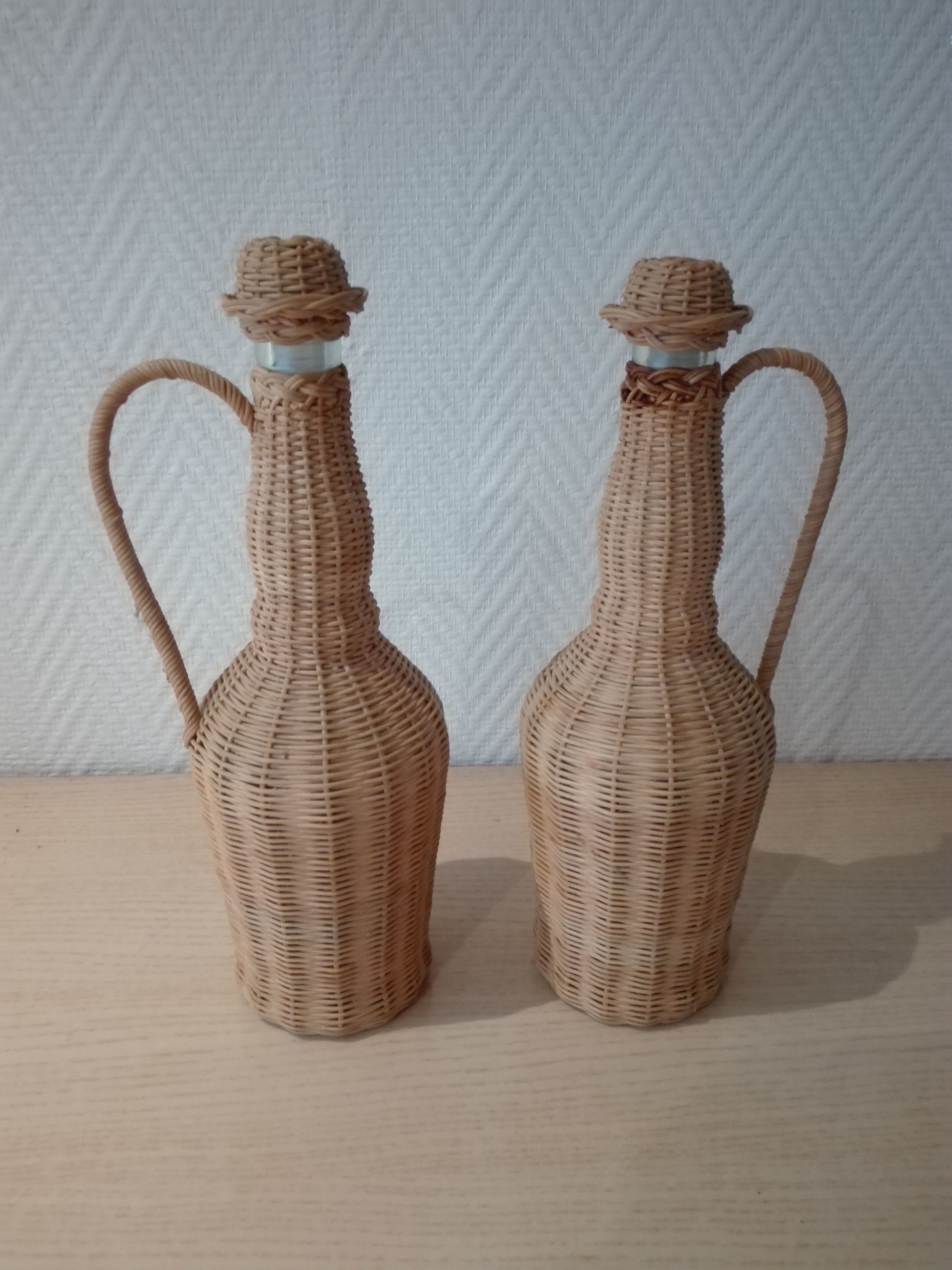 Vintage rattan bottle duo