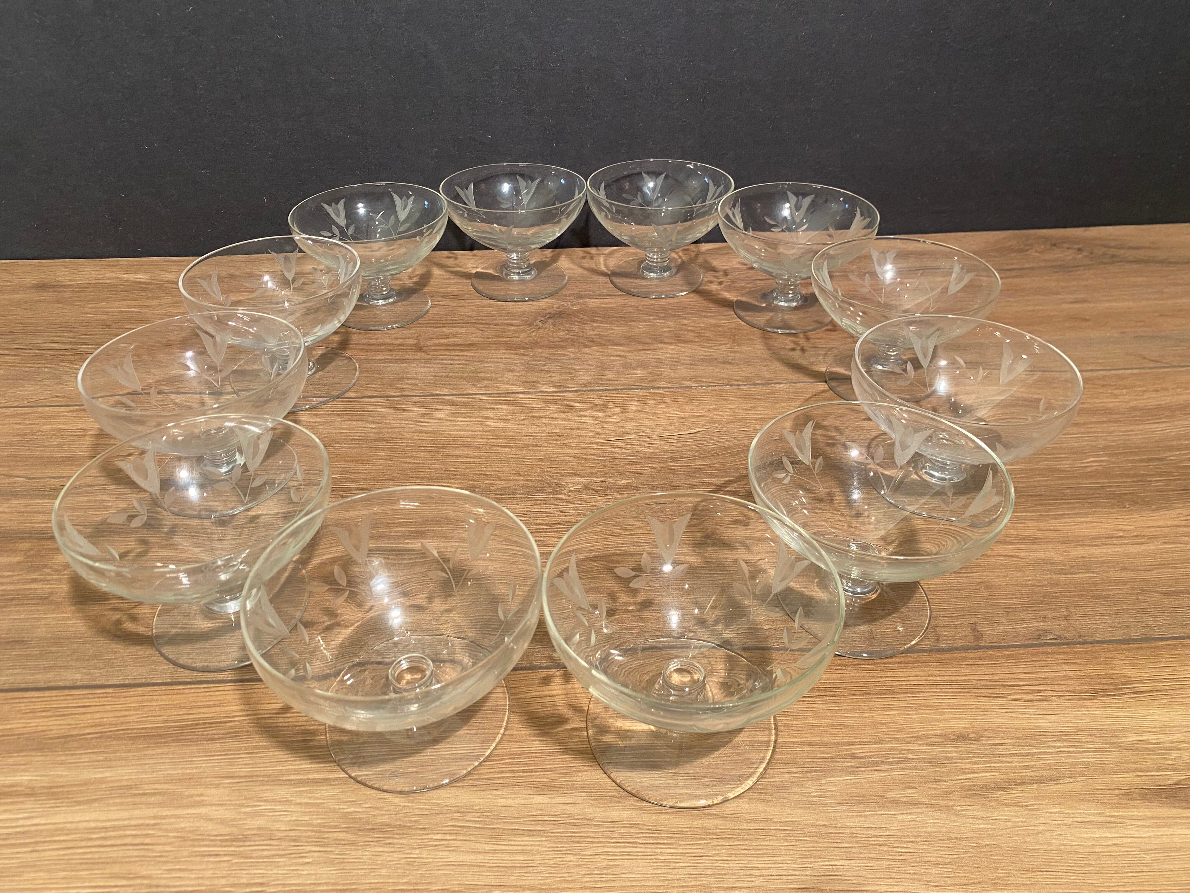 Suite of 12 champagne glasses in cut glass with floral decoration