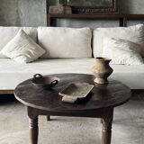 Coffee table, round antique Indonesian teak table with straight legs.