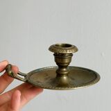 Brass candle holder with handle.