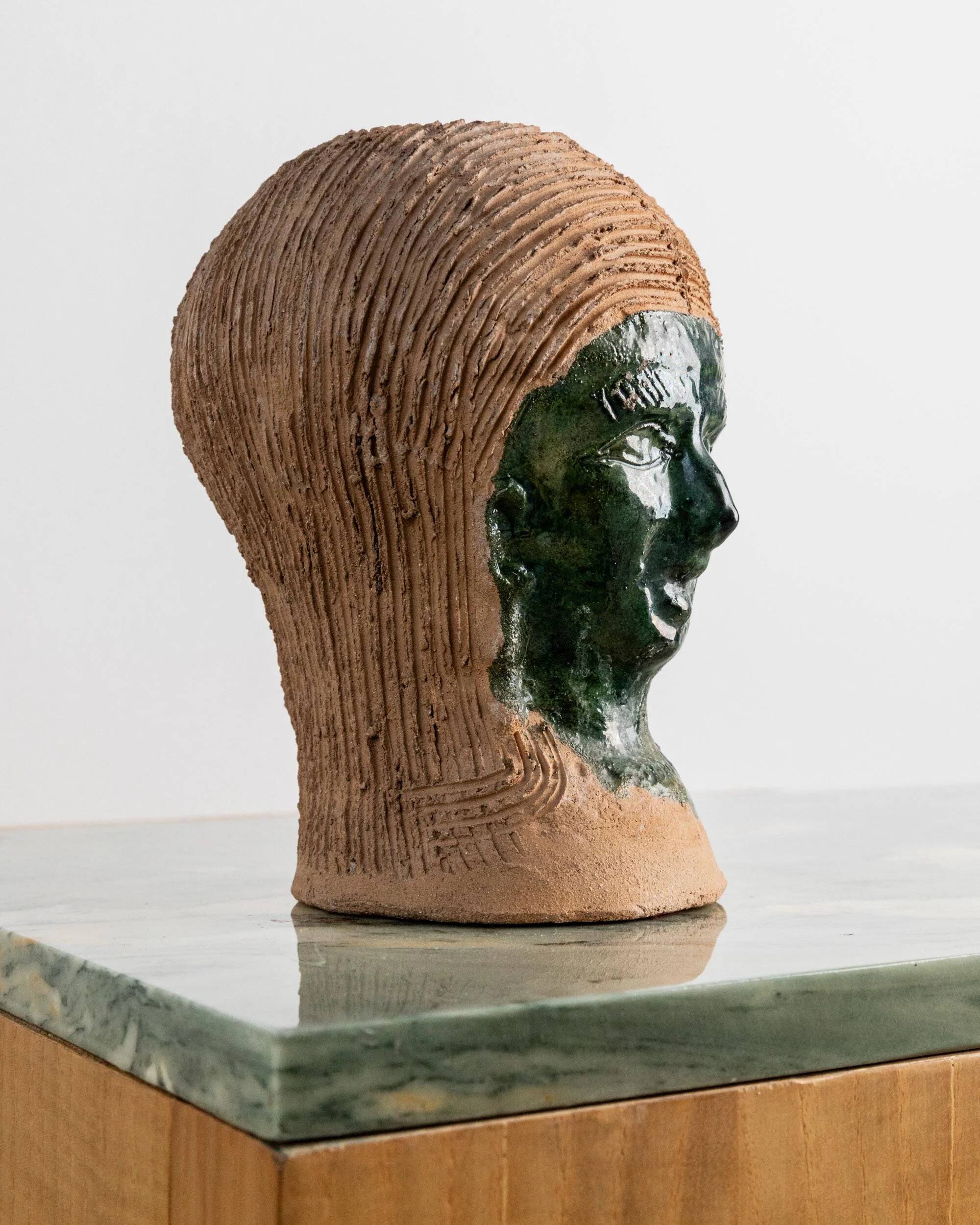Vintage ceramic vase from the 1980s, sculptural head shape with a green glazed face, terracotta art object.