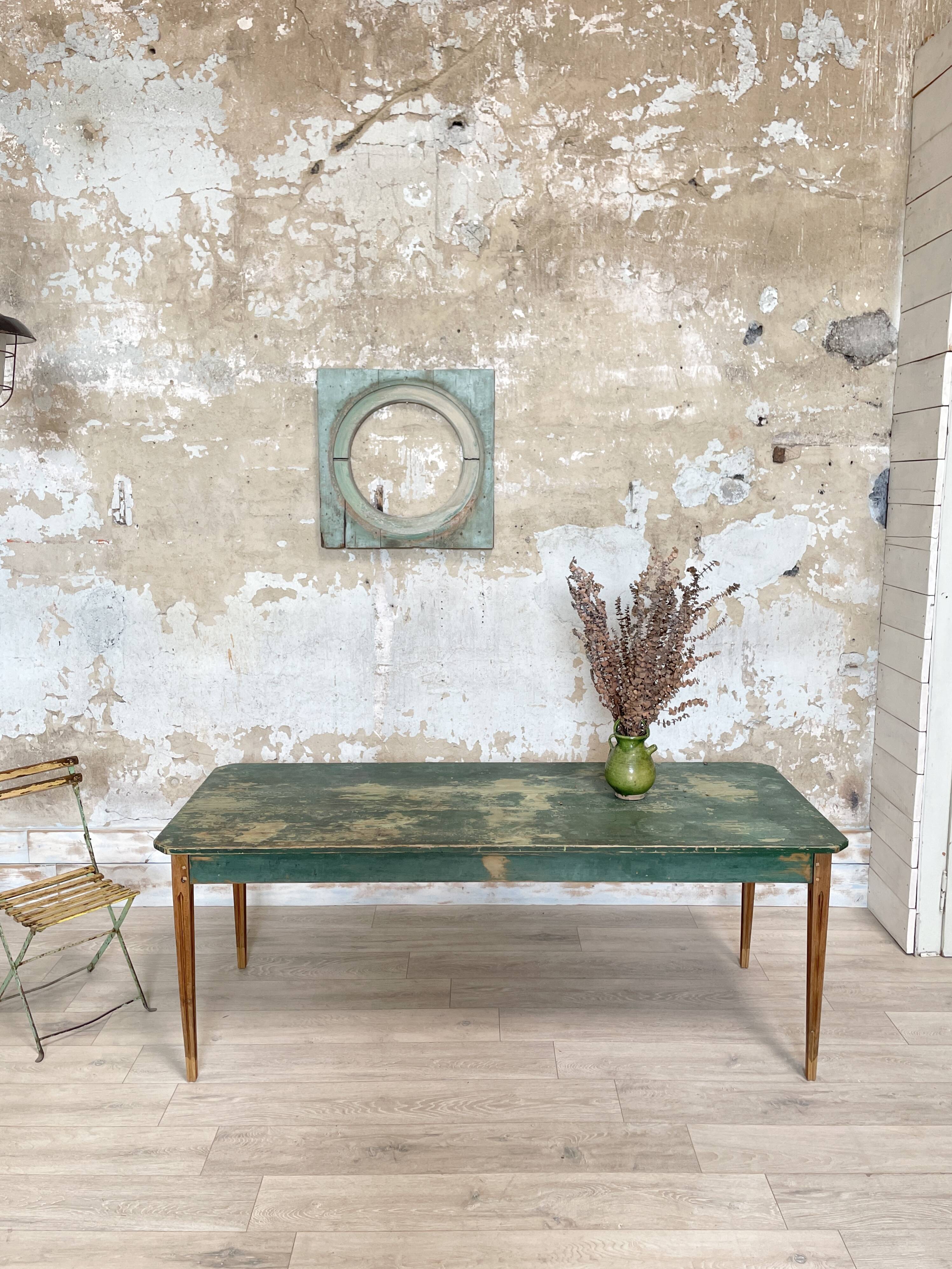 Vintage farm table with spindle legs.