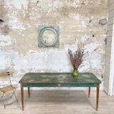 Vintage farm table with spindle legs.