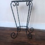 Black wrought iron support for plants