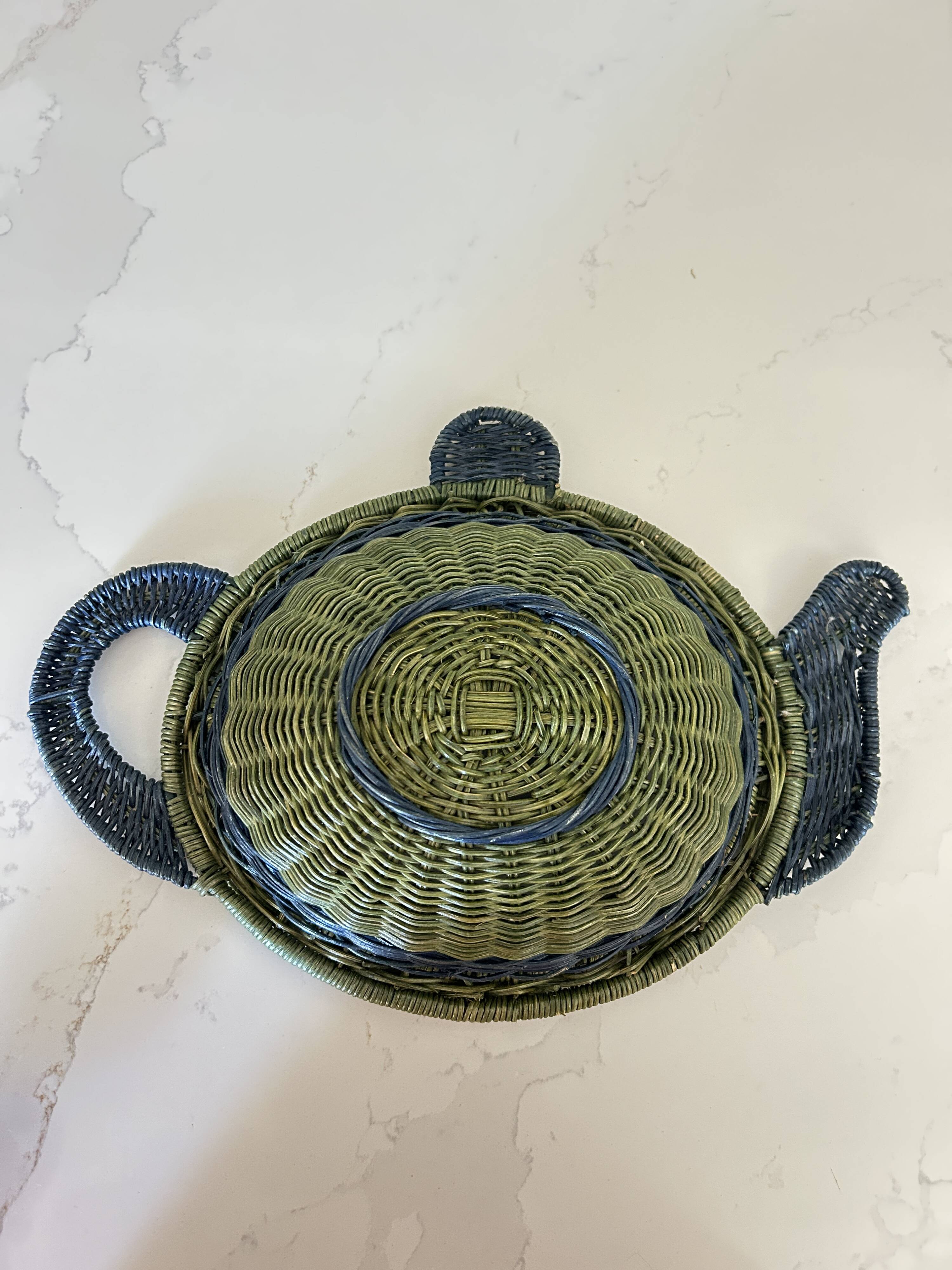 Rattan basket in the shape of a teapot.