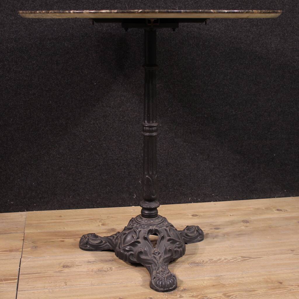 20th-century French iron bistro table with a marble top.
