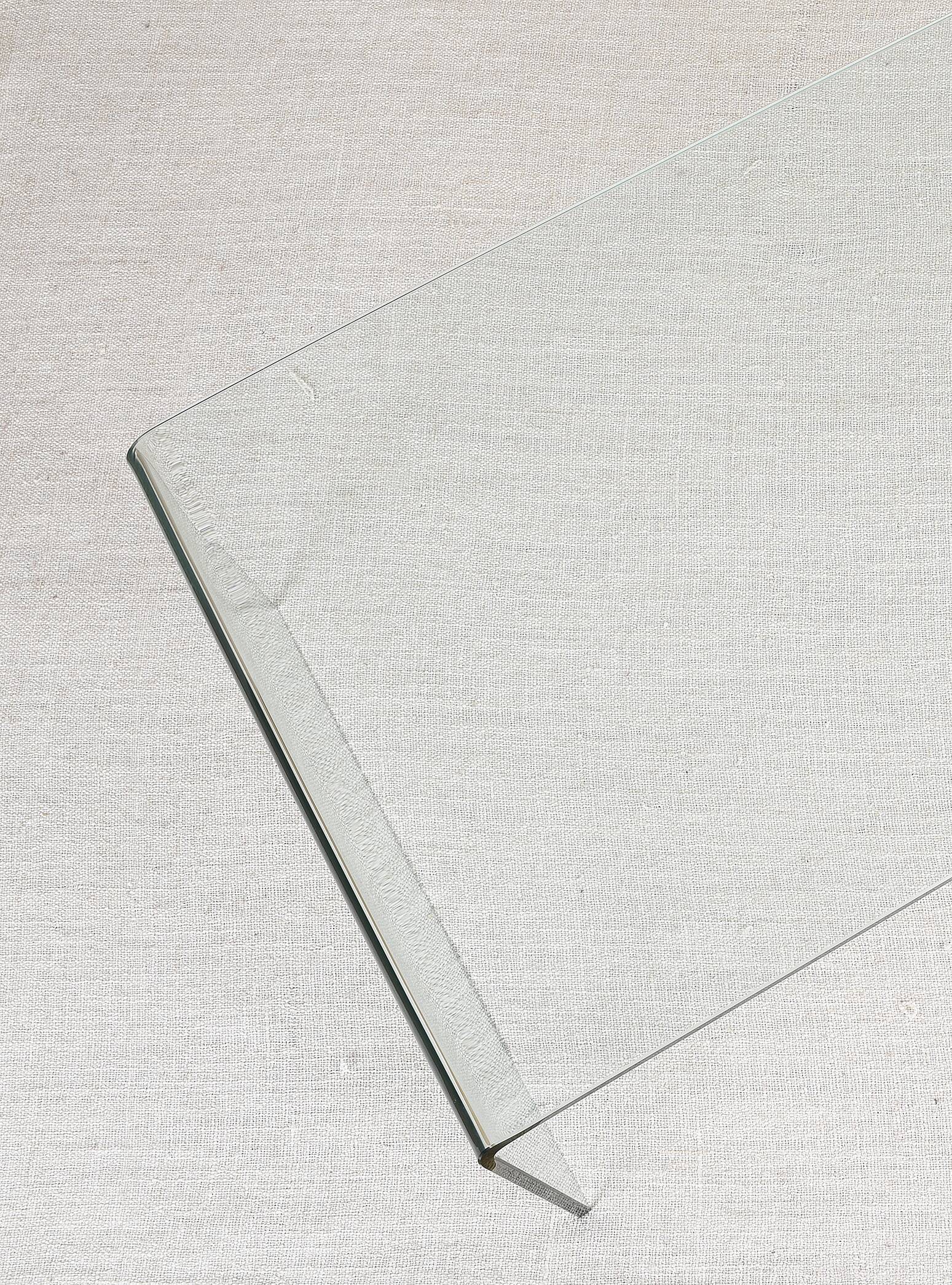 Transparent tempered glass coffee table.