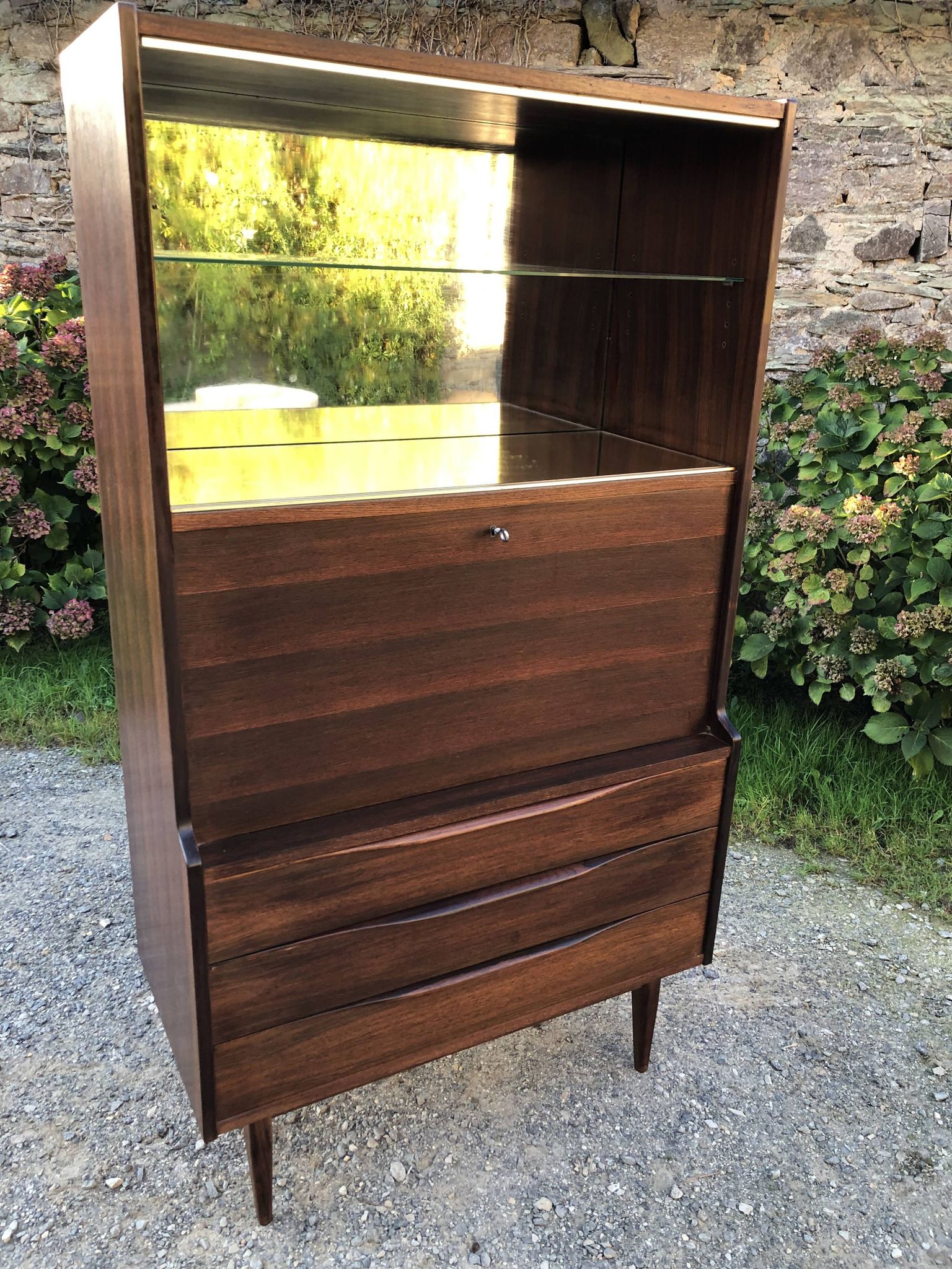 Vintage Scandinavian secretary in rosewood with drawers featuring fin-style handles.
