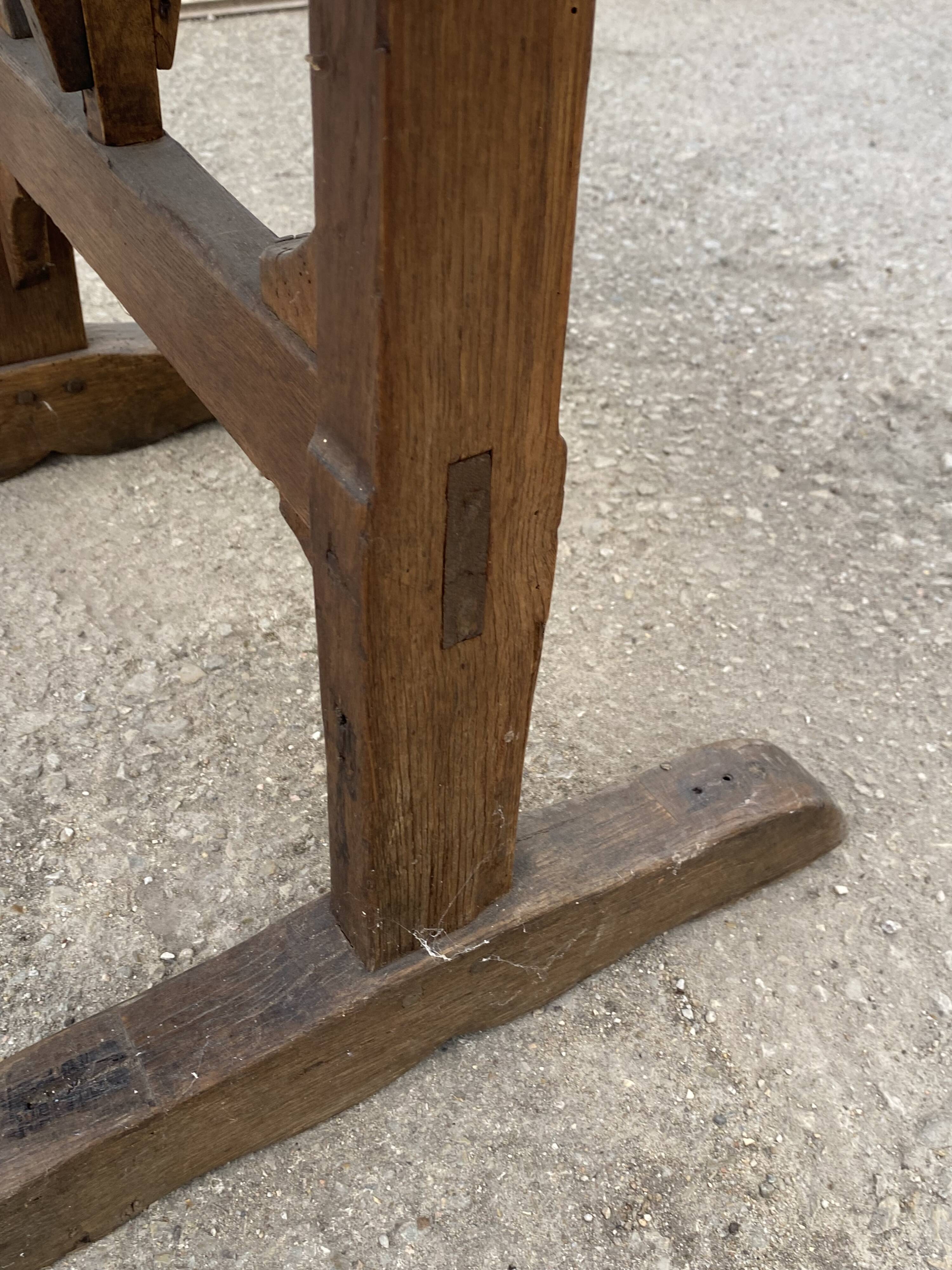Old folding round winemaker's table with a tilting top.