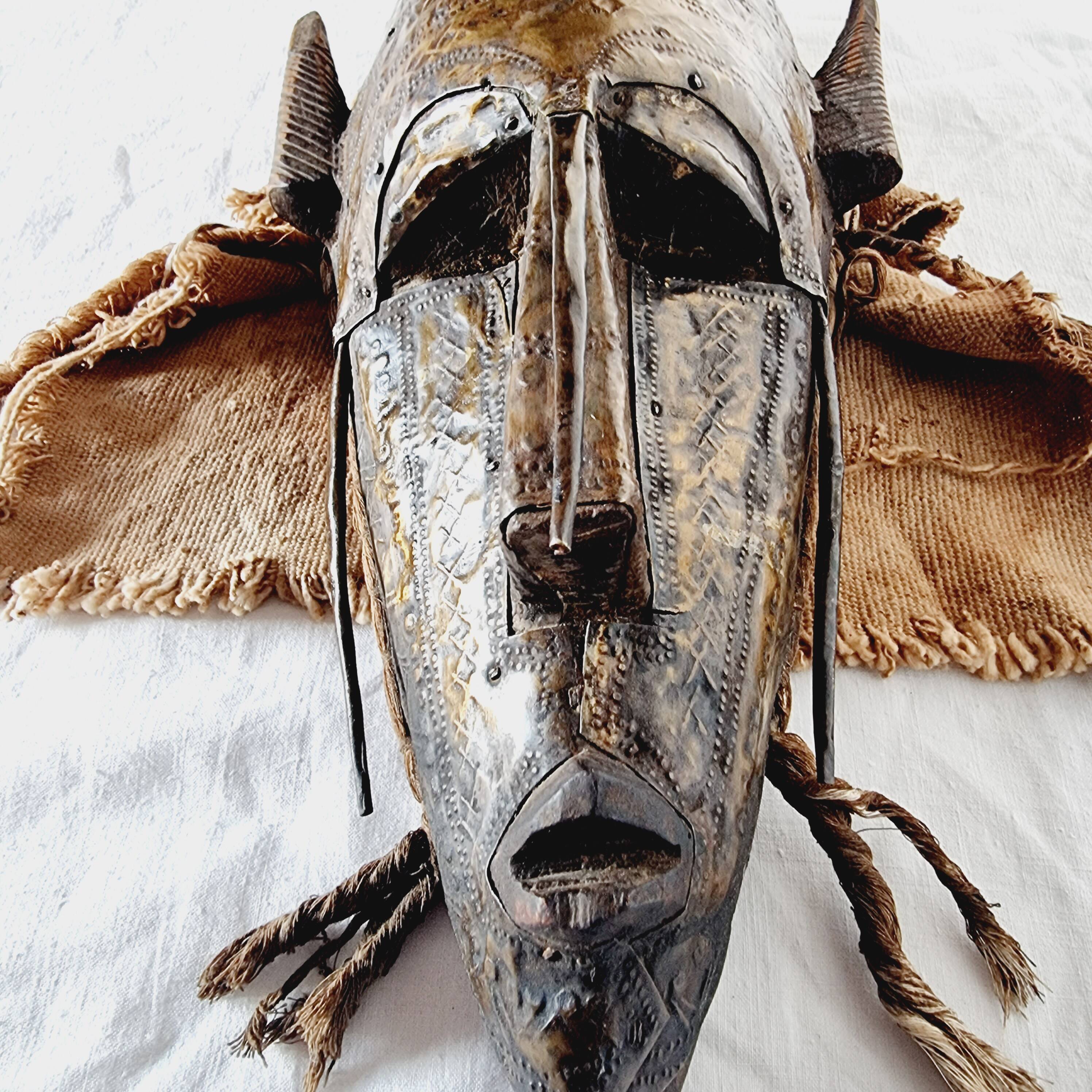 African mask from Mali from the N'Tomo tribe of Marka covered in chiseled brass