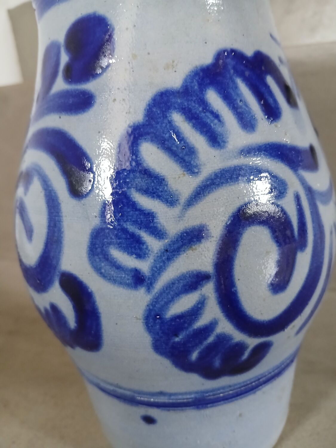 2 antique stoneware pitchers