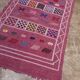 Handmade Moroccan wool rug: Berber Azilal style, geometric pattern.