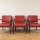 3 red leather and metal armchairs