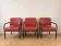 3 red leather and metal armchairs