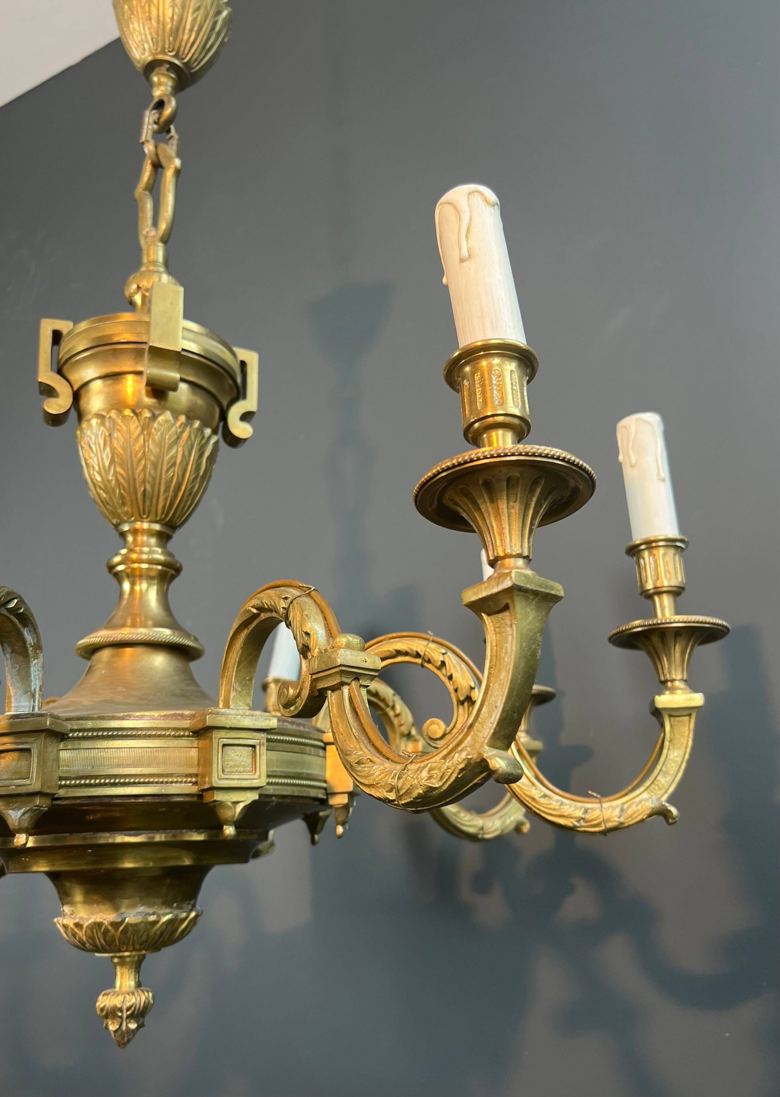 Important Louis XVI style chiseled bronze chandelier with 8 light arms by Lucien Gau