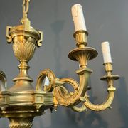 Important bronze chiseled chandelier in Louis XVI style with 8 light arms by Lucien Gau.