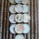 13 mismatched flat plates in ironstone