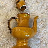 Teapot in yellow ceramic with the logo
