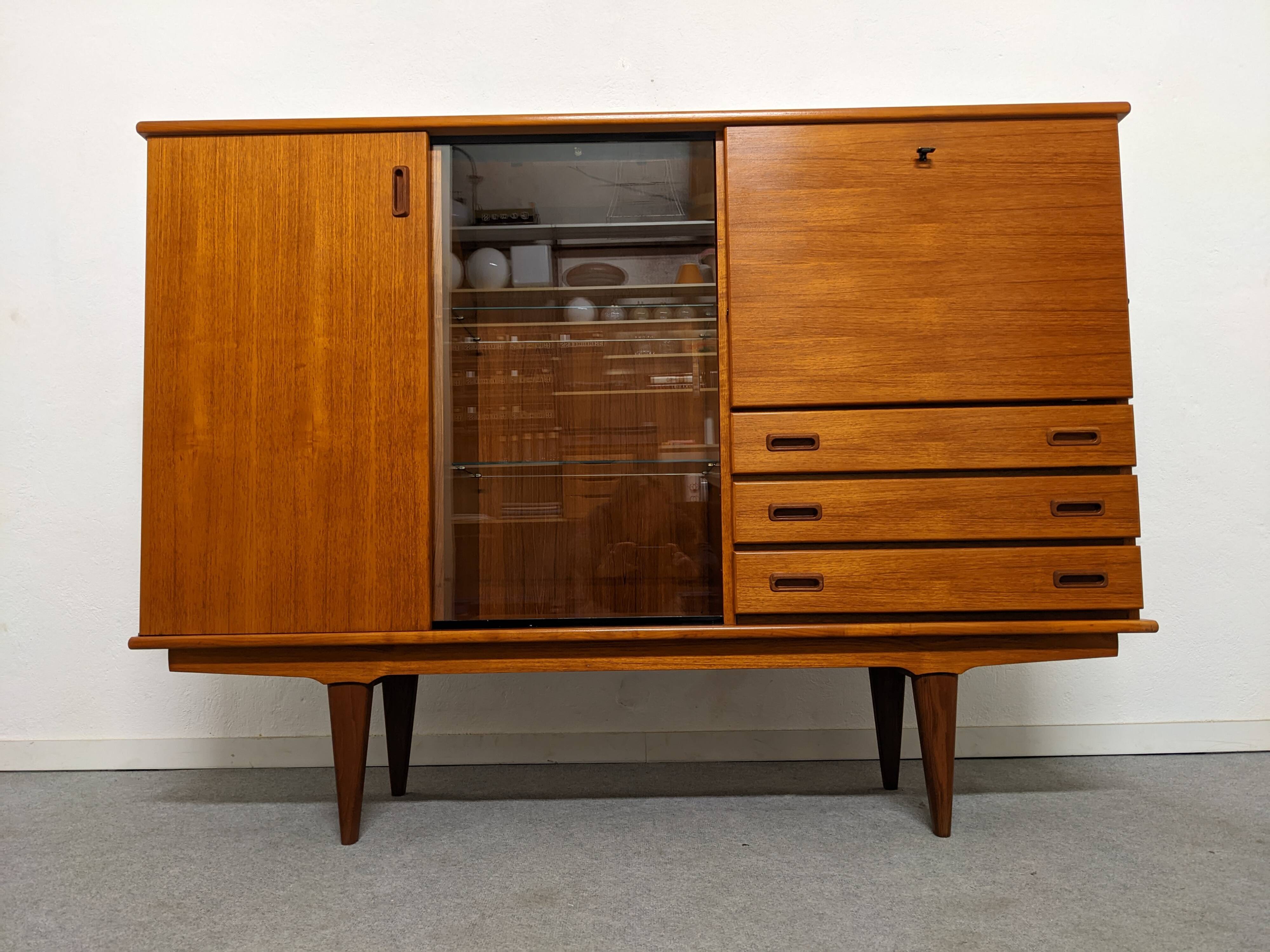 High sideboard, display cabinet and secretary, Scandinavian in teak, France around 1960.