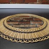 Vintage round mirror in a wicker frame