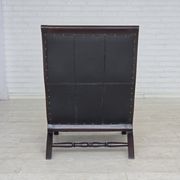 1970s, vintage armchair with footstool, black furniture leather.
