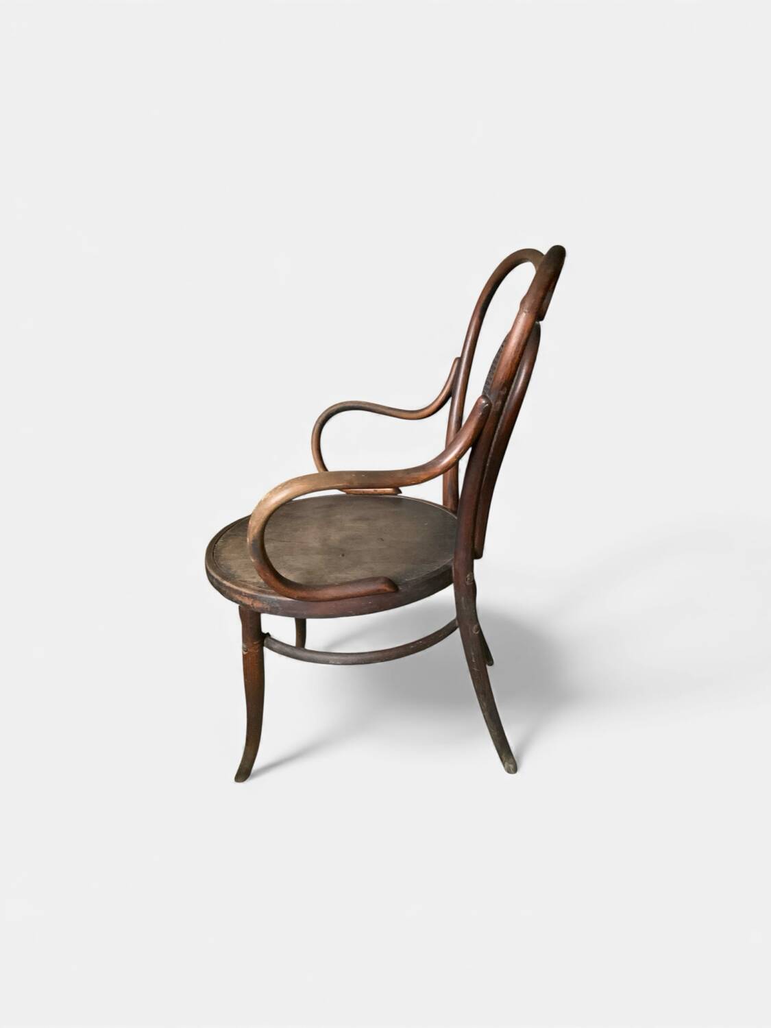 Antique curved wooden armchair with caning – Bistro style