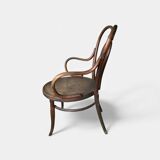 Antique curved wooden armchair with caning – Bistro style
