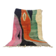 Large handmade Moroccan rug with colourful patterns.
