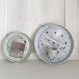 Two round molded glass ceiling lights