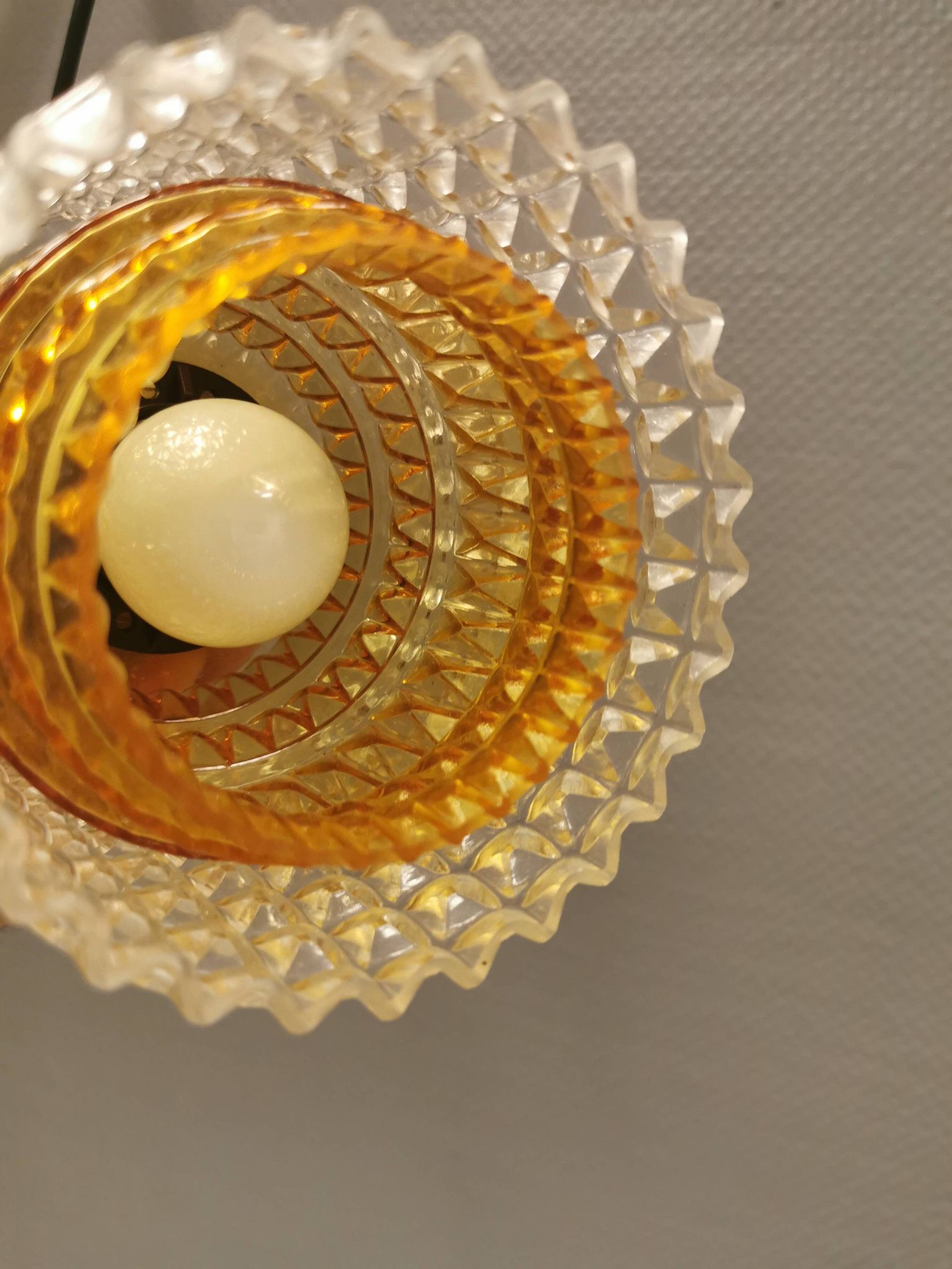Older Swedish hanging lamp in multi-layered crystal glass with rosewood top and brass ring.