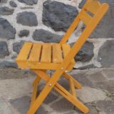 Pair of folding chairs in blond wood