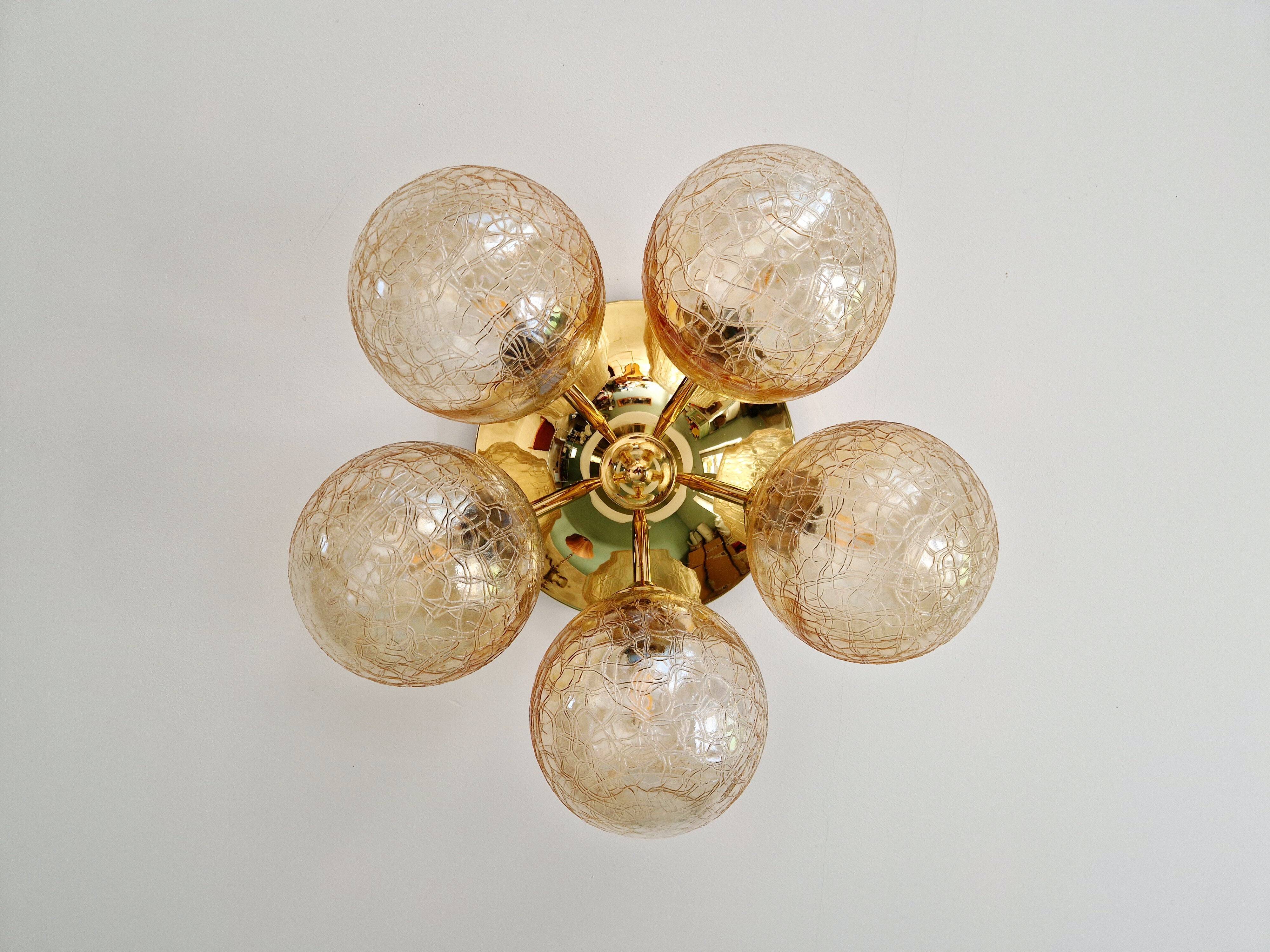 Large designer ceiling light in brass and amber crackled glass, 1970s.
