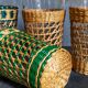 Four long drink glasses in vintage woven rattan cases