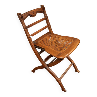 Chaise pliante cannée début XXe en bois