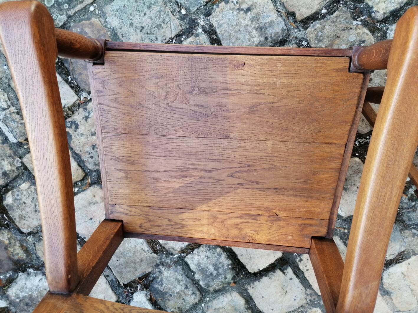 Pair of vintage oak armchairs with geometric design.