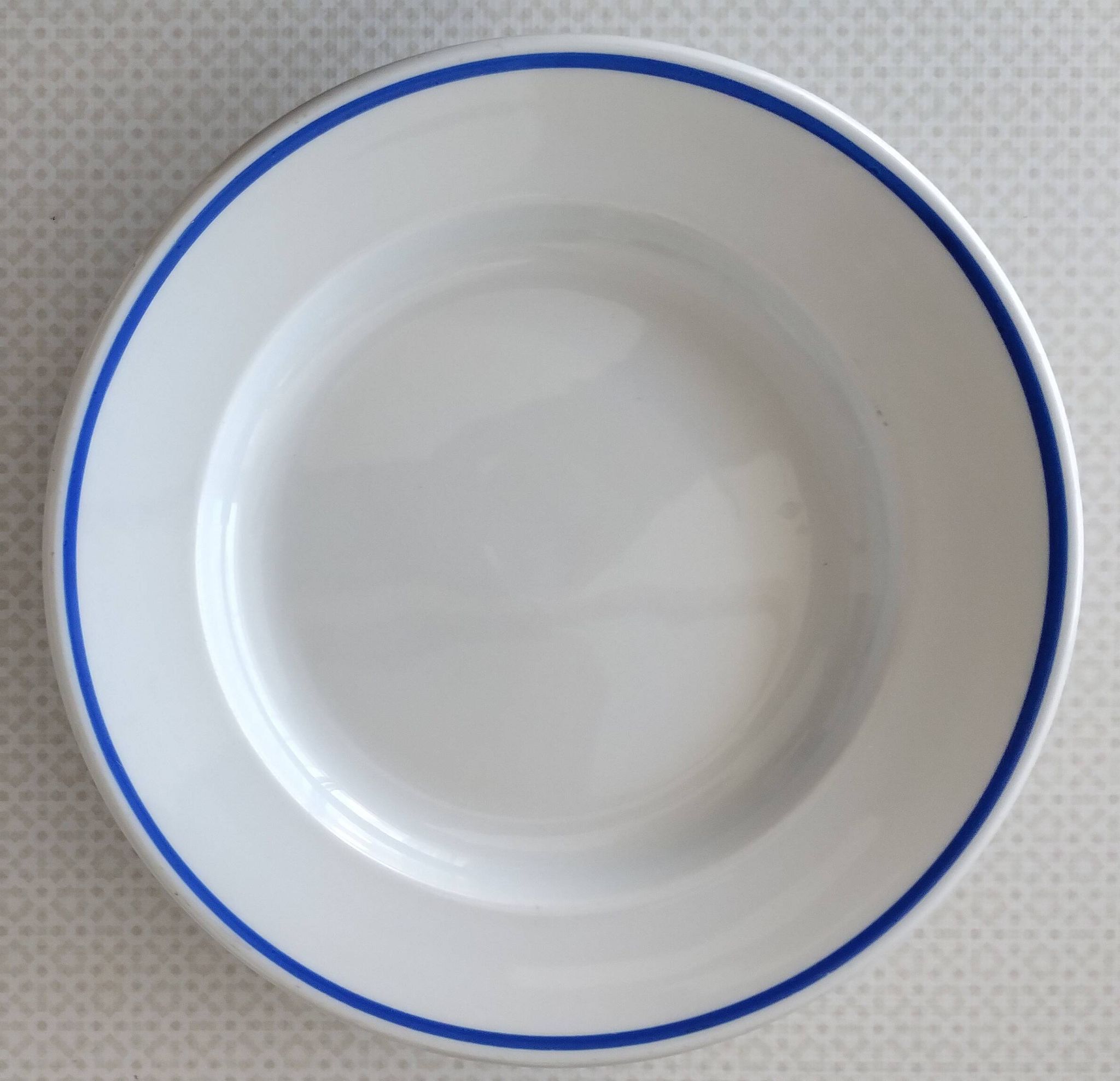 3 Pillivuyt white porcelain dinner plates with blue edging.