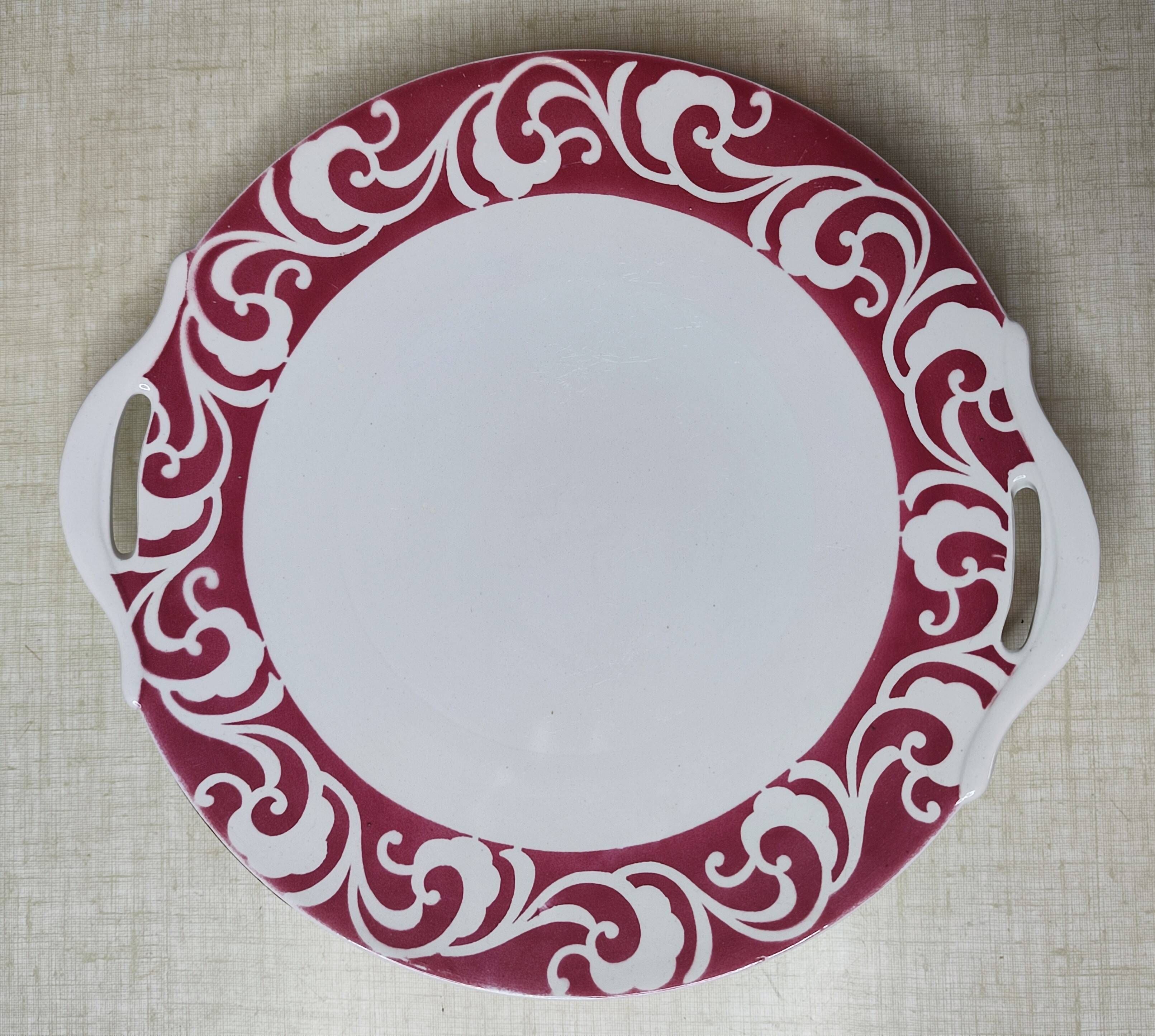 Lot of 17 vintage porcelain plates and a platter from the 1940s