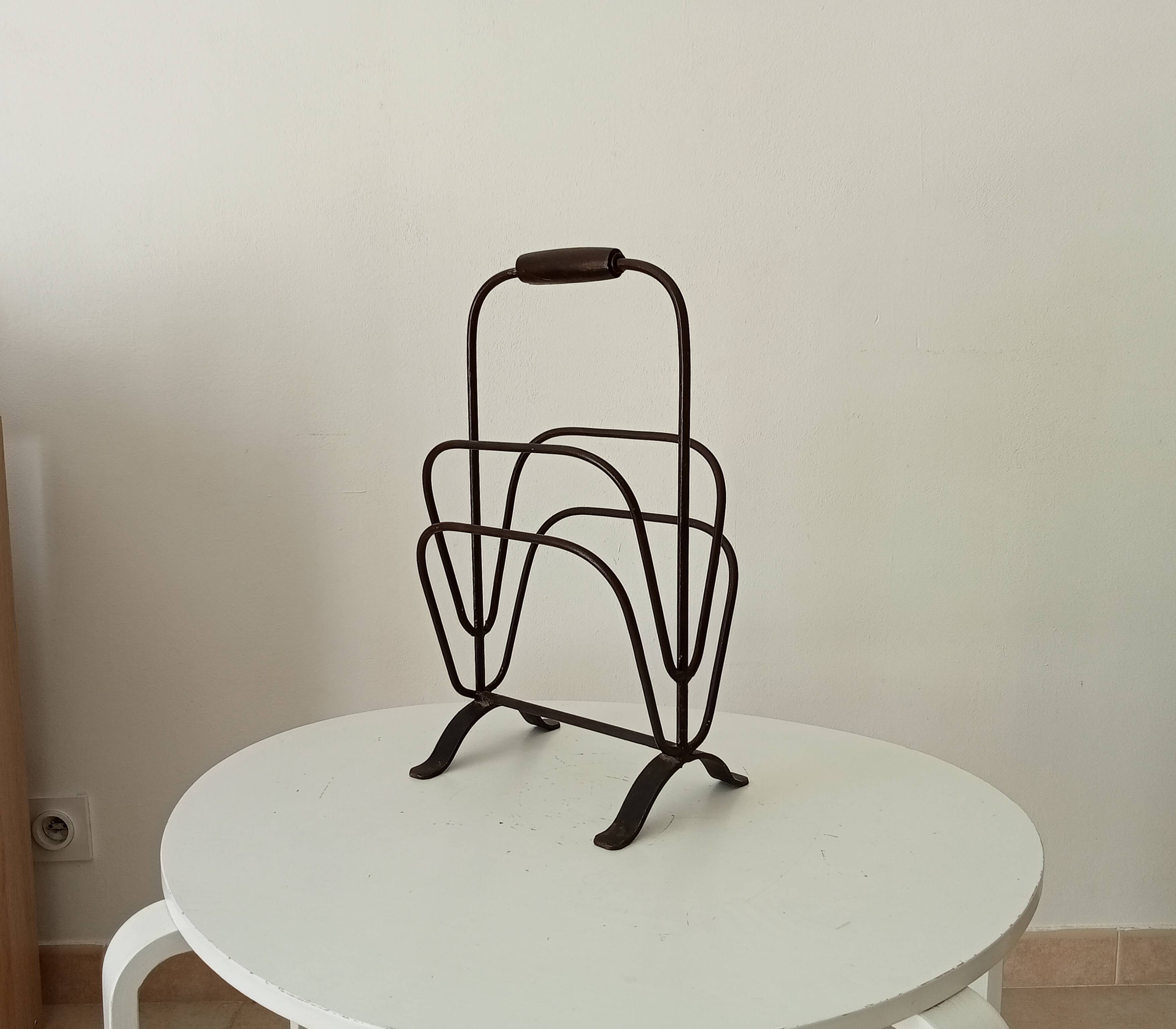 Brutalist wrought iron magazine rack from the 1960s.