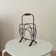 Brutalist wrought iron magazine rack from the 1960s.